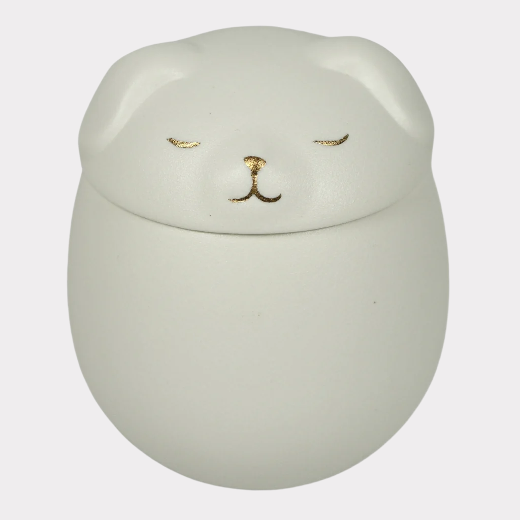 White puppy ceramic urn