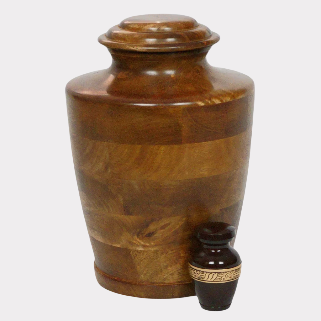 Brown keepsake urn with gold leaf detailed band next to full size traditional wooden urn