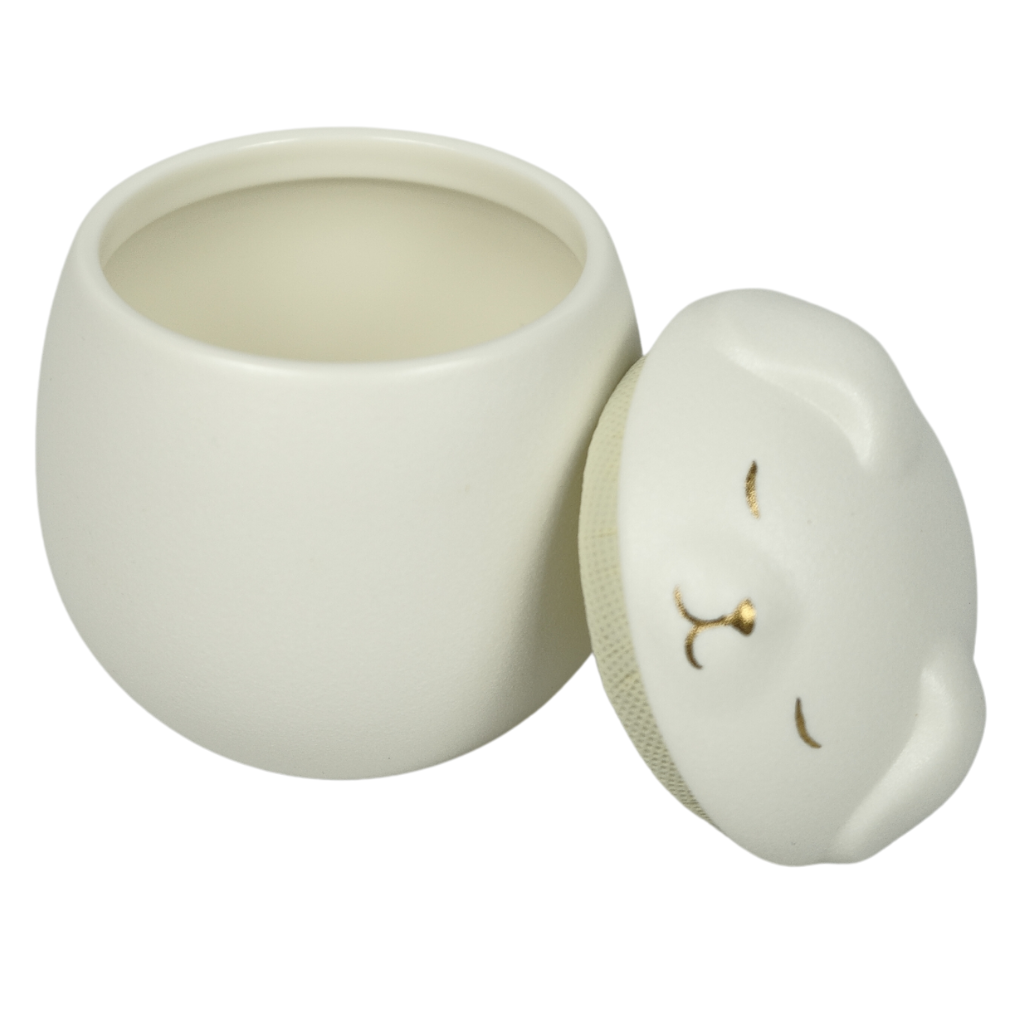 White puppy ceramic urn
