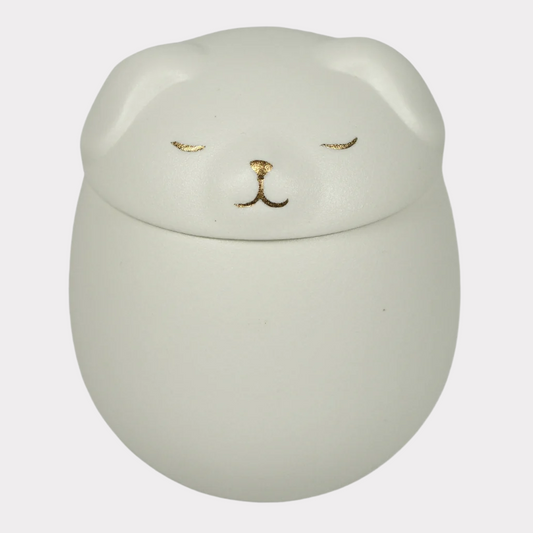 White puppy ceramic urn