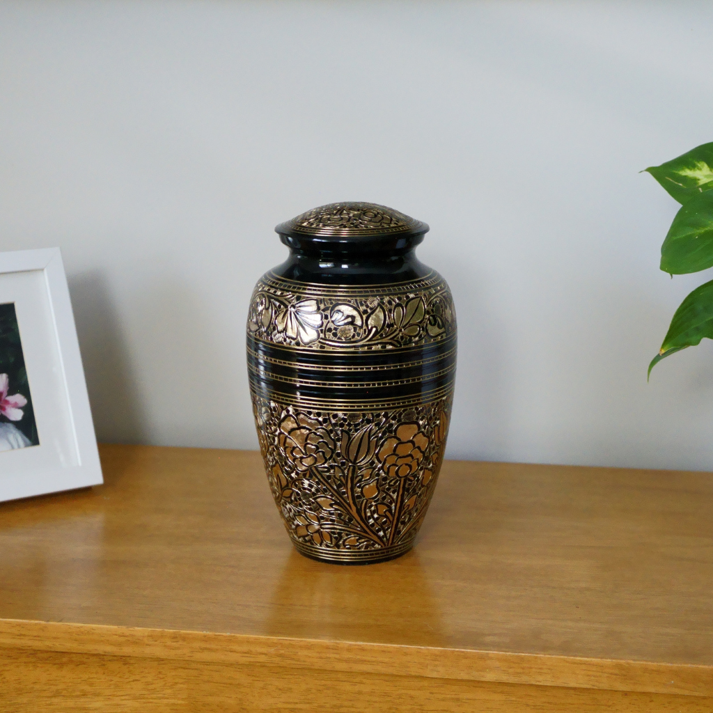 brass urn with flower patterns